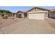 Charming home featuring a two-car garage and desert landscaping in the front yard at 1244 E Princeton Ave, Gilbert, AZ 85234