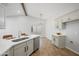 Modern kitchen with white countertops, stainless steel appliances, and an adjacent dining area at 1244 E Princeton Ave, Gilbert, AZ 85234