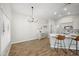 Bright kitchen and dining area with modern lighting, stainless steel appliances, and breakfast bar seating at 1244 E Princeton Ave, Gilbert, AZ 85234