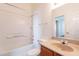 Bright bathroom featuring a tiled shower-tub combination and neutral vanity at 1331 W Baseline Rd # 340, Mesa, AZ 85202