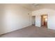 Spacious bedroom with neutral carpet, ceiling fan, and ensuite bathroom entrance at 1331 W Baseline Rd # 340, Mesa, AZ 85202