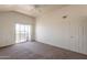 Bright bedroom featuring a sliding glass door to a balcony and ceiling fan at 1331 W Baseline Rd # 340, Mesa, AZ 85202