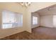 Bright dining area with large windows, a chandelier, and easy access to other rooms at 1331 W Baseline Rd # 340, Mesa, AZ 85202