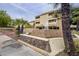 Inviting condo exterior with well-manicured landscaping and a decorative water fountain feature at 1331 W Baseline Rd # 340, Mesa, AZ 85202