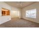 Spacious living room with a ceiling fan, natural light, and easy access to the dining area at 1331 W Baseline Rd # 340, Mesa, AZ 85202