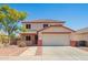 Charming two-story home with desert landscaping, a two-car garage, and red trim at 13321 N 124Th Ave, El Mirage, AZ 85335