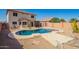 Lovely backyard pool with a stylish deck, surrounded by a low-maintenance desert landscape at 13321 N 124Th Ave, El Mirage, AZ 85335