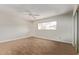 Bright bedroom with wood floors, a ceiling fan, and a large window that provides natural light at 14426 N 52Nd Ave, Glendale, AZ 85306