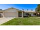 Charming single-story home with a well-manicured lawn and attached two-car garage at 14426 N 52Nd Ave, Glendale, AZ 85306