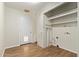 Dedicated laundry room with utility sink and extra shelving at 14426 N 52Nd Ave, Glendale, AZ 85306