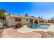 An inviting backyard pool with a brick patio offers a perfect space for relaxation and entertaining at 14426 N 52Nd Ave, Glendale, AZ 85306