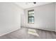 Bright bedroom with neutral walls and light gray carpet and a window at 1446 E Canary Dr, Gilbert, AZ 85297