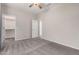 Bright bedroom with neutral walls, light gray carpet, and a closet at 1446 E Canary Dr, Gilbert, AZ 85297