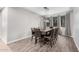 Dining room with a large wooden table and chairs and a modern chandelier at 1446 E Canary Dr, Gilbert, AZ 85297