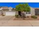 Charming single-story home with a two-car garage and well-maintained desert landscaping at 1446 E Canary Dr, Gilbert, AZ 85297