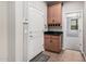 Mud room features a countertop, cabinets, and a door to the garage at 1446 E Canary Dr, Gilbert, AZ 85297