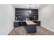 Office features built-in desk and stylish shelving for storage and decor at 1446 E Canary Dr, Gilbert, AZ 85297