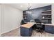 Office with custom built-in desk and shelving for storage and decor at 1446 E Canary Dr, Gilbert, AZ 85297