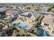 Aerial view of a home with a pool, solar panels, and lush landscaping in a Gathering-friendly neighborhood at 14837 W Crocus Dr, Surprise, AZ 85379
