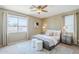Inviting bedroom with a plush bed, soft color palette, natural light, and coordinated decor, creating a peaceful retreat at 14837 W Crocus Dr, Surprise, AZ 85379