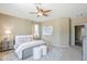 Cozy bedroom features soft colors, plush bedding, natural light, and coordinated nightstands for a relaxing atmosphere at 14837 W Crocus Dr, Surprise, AZ 85379