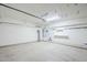 Spacious garage interior with ample storage space and modern utilities at 14837 W Crocus Dr, Surprise, AZ 85379