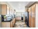 Kitchen featuring maple cabinets, black tile backsplash, and stainless steel appliances at 14837 W Crocus Dr, Surprise, AZ 85379