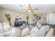 Well-lit living area featuring tile floors, neutral colors, and stylish modern decor at 14837 W Crocus Dr, Surprise, AZ 85379