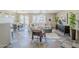 Spacious living room featuring tile flooring, comfortable seating, and backyard access at 14837 W Crocus Dr, Surprise, AZ 85379
