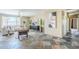 Open living room with tile flooring, natural light, and stylish decor at 14837 W Crocus Dr, Surprise, AZ 85379