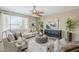 Cozy living room with plush seating, stylish decor, and ample natural light at 14837 W Crocus Dr, Surprise, AZ 85379
