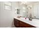 Bathroom featuring a dark wood vanity and large mirror with views of the entrance at 1525 W Bent Tree Dr, Phoenix, AZ 85085