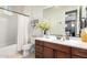 This bathroom offers a single sink vanity, white countertop, and shower with tub at 1525 W Bent Tree Dr, Phoenix, AZ 85085