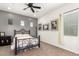 This bedroom features neutral decor, a dark metal bed frame, and a ceiling fan at 1525 W Bent Tree Dr, Phoenix, AZ 85085