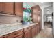 Kitchen featuring granite countertops, wood cabinets, and tile backsplash at 1525 W Bent Tree Dr, Phoenix, AZ 85085