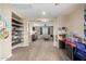 Comfortable living room featuring an open layout, built-in shelving, and plush carpeting at 1525 W Bent Tree Dr, Phoenix, AZ 85085