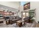 Bright and airy living room featuring high ceilings, comfortable seating, and an open floor plan into the backyard at 1525 W Bent Tree Dr, Phoenix, AZ 85085