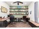 Spacious home office with shelving, desk and hardwood floors at 1525 W Bent Tree Dr, Phoenix, AZ 85085