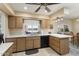 Bright kitchen featuring a double sink, black dishwasher, and ample counter space, perfect for meal preparation at 15621 N Lakeforest Dr, Sun City, AZ 85351