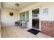 Cozy covered patio with tiled floor and comfortable seating, ideal for relaxing outdoors at 15621 N Lakeforest Dr, Sun City, AZ 85351