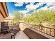 Relax on this balcony with comfortable chairs and enjoy panoramic views of the beautiful desert landscape at 16420 N Thompson Peak Pkwy # 1064, Scottsdale, AZ 85260