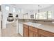 Well-lit kitchen offering views into the living room and featuring modern sink and tile backsplash at 16420 N Thompson Peak Pkwy # 1064, Scottsdale, AZ 85260