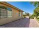 Brick walkway and arched windows enhance the home's architectural charm and appeal at 17203 E Starflower Ct, Queen Creek, AZ 85142