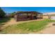 Horse shelter with fencing for livestock in an outdoor area, providing a safe and secure enclosure on the property at 17203 E Starflower Ct, Queen Creek, AZ 85142