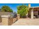 Built-in outdoor kitchen with barbecue, ideal for alfresco dining and summer gatherings at 17203 E Starflower Ct, Queen Creek, AZ 85142