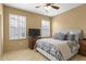 Cozy bedroom with neutral walls and a bright window with shutters at 17335 W Gould Mine Ln, Surprise, AZ 85387