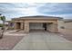 Spacious garage with open door showcasing a clean and organized parking and storage area at 17335 W Gould Mine Ln, Surprise, AZ 85387