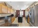 Bright kitchen featuring stainless appliances, center island, and tile flooring at 17335 W Gould Mine Ln, Surprise, AZ 85387