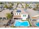 Aerial view of a two-story home with a private pool, solar panels, and outdoor dining area at 17423 W Yavapai St, Goodyear, AZ 85338