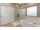 Bright bathroom with a separate shower and soaking tub at 17423 W Yavapai St, Goodyear, AZ 85338